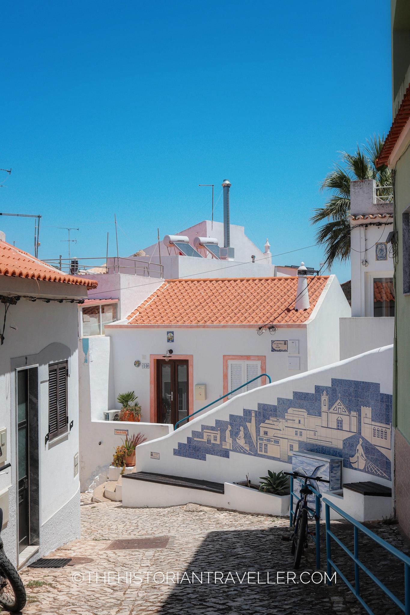 One of the alleys of Ferragudo with an azulejo tile work