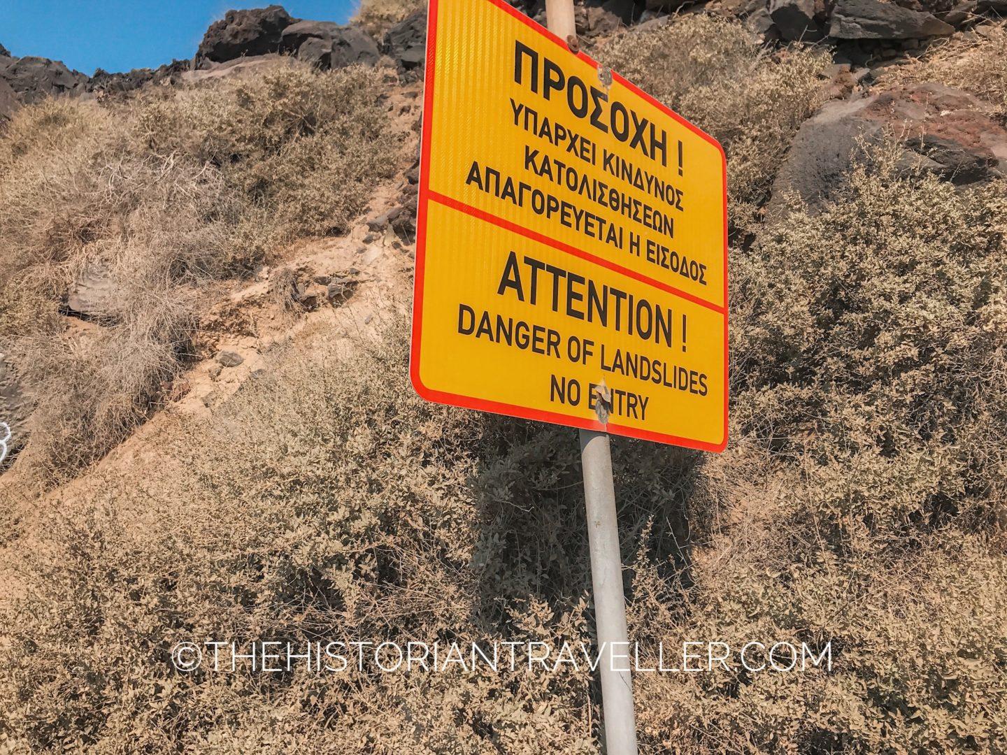 Red beach Santorini - warning sign