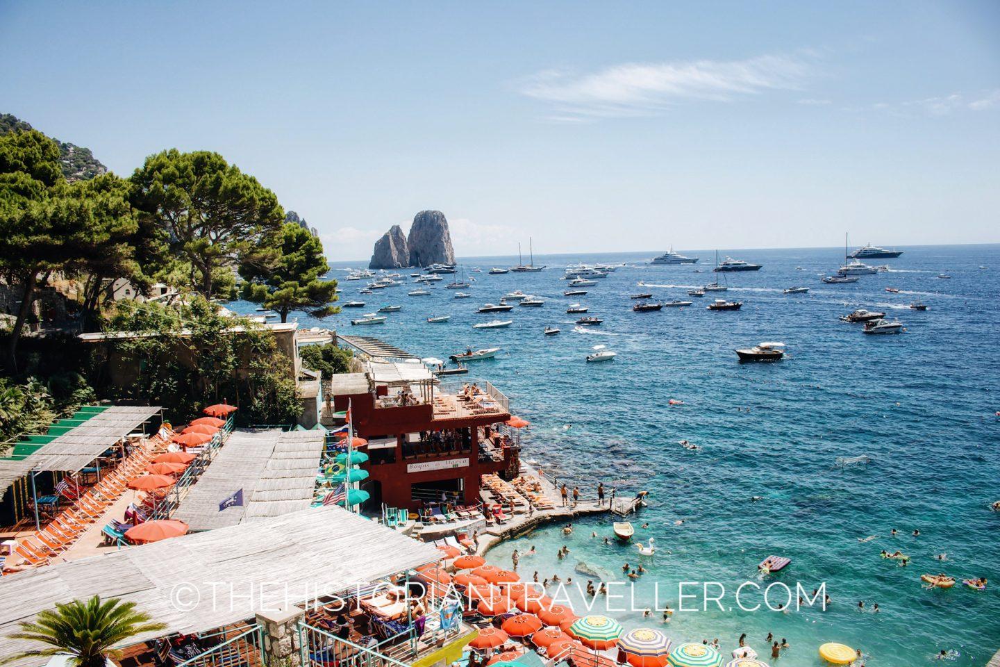 View of the Capri Faraglioni from Marina Piccola in a sunny day of summer Capri scooter itinerary