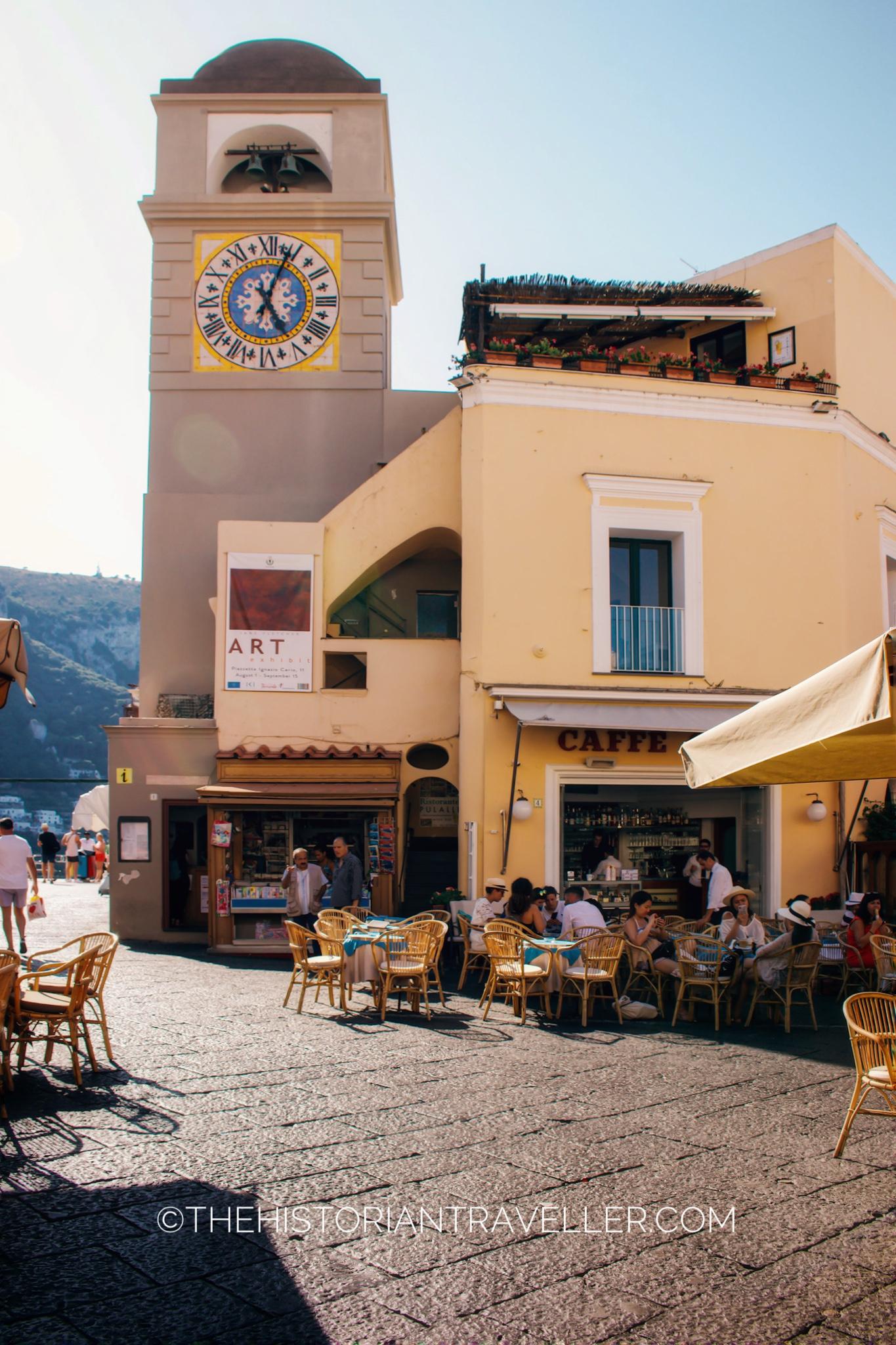 Piazzetta of Capri town and its cafes - tower clock on dusk