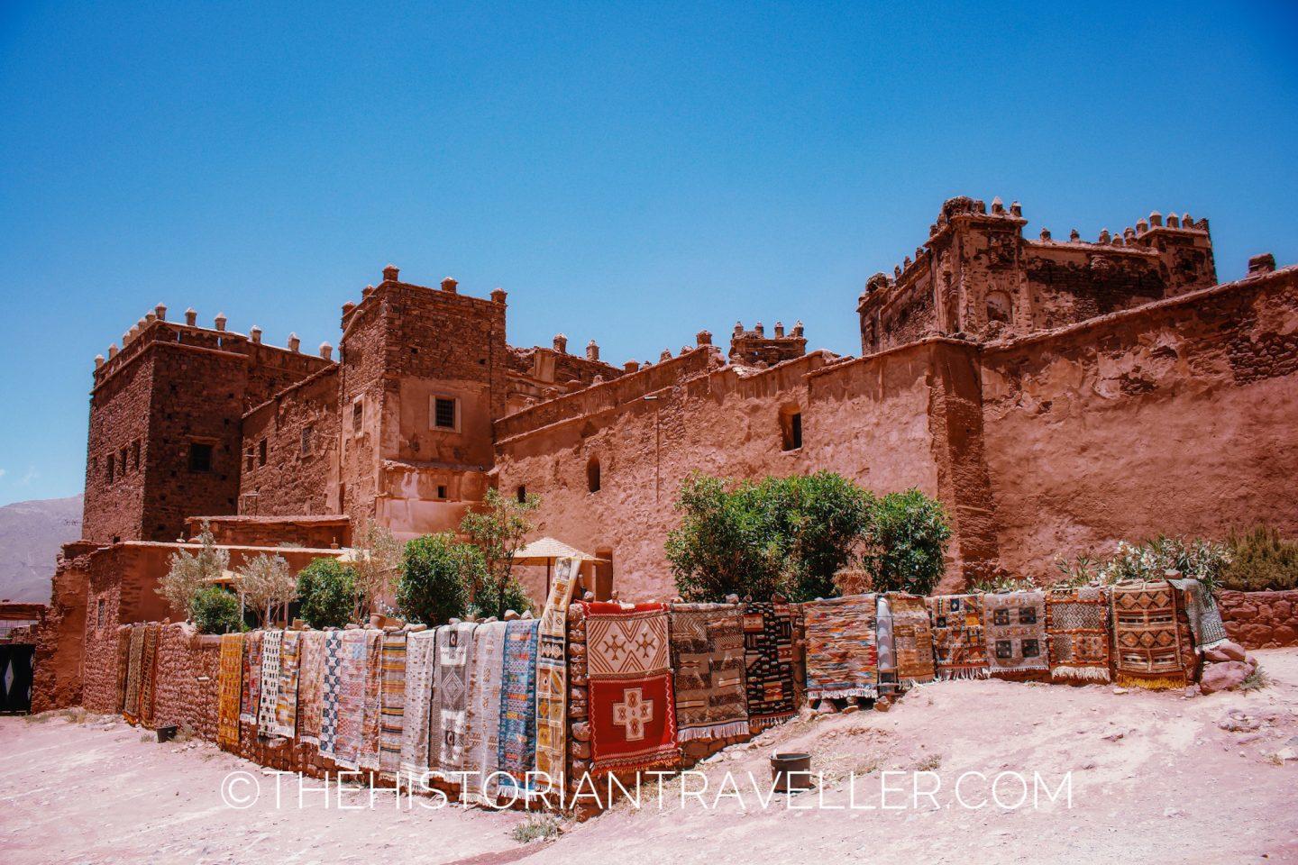Road of Thousand Kasbahs itinerary - Telouet Kasbah's View of the exterior architecture and berber carpets