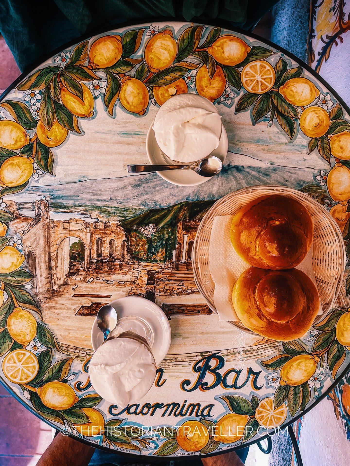 table displaying two granita and brioches