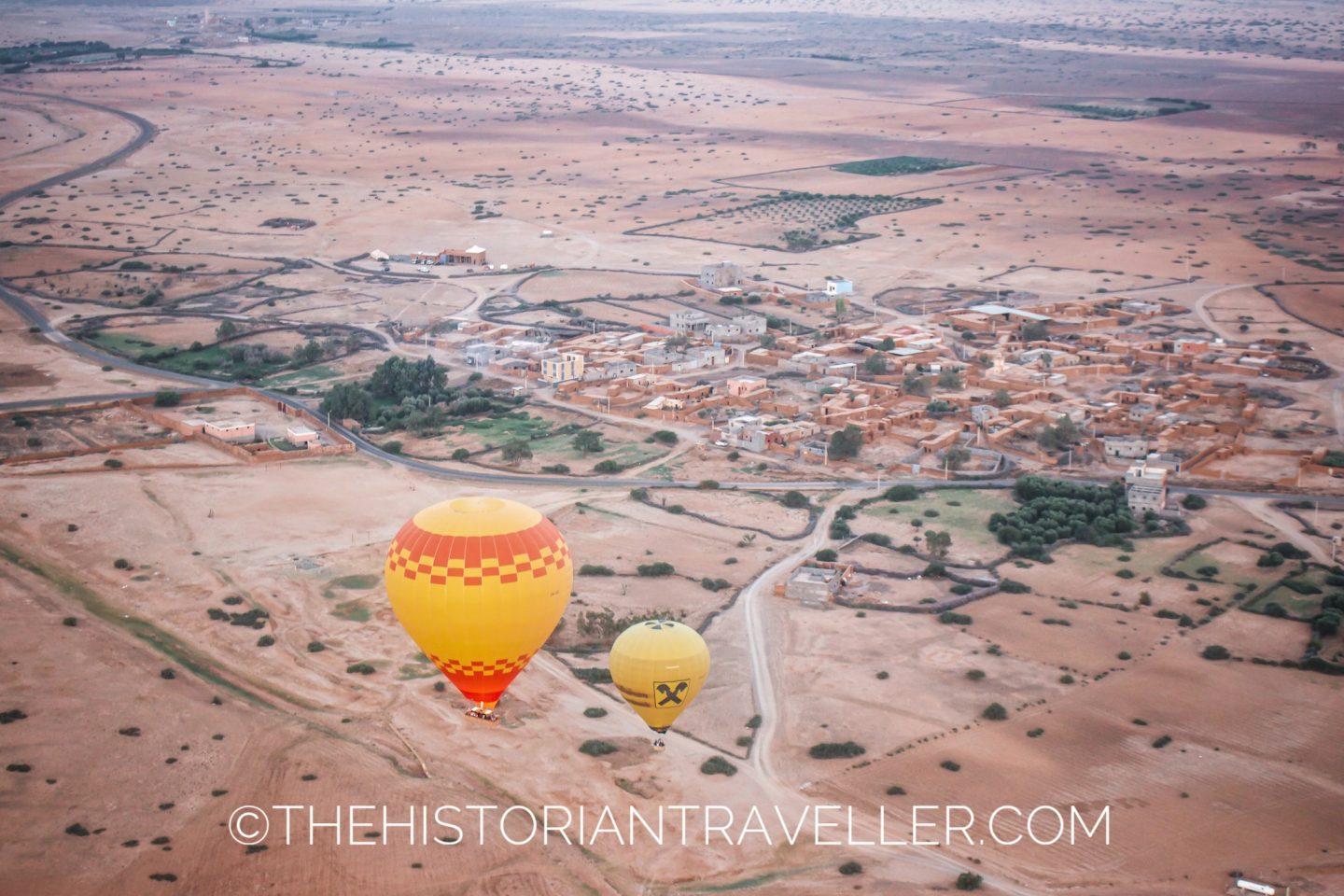 view of two hot air balloons flying from the sky